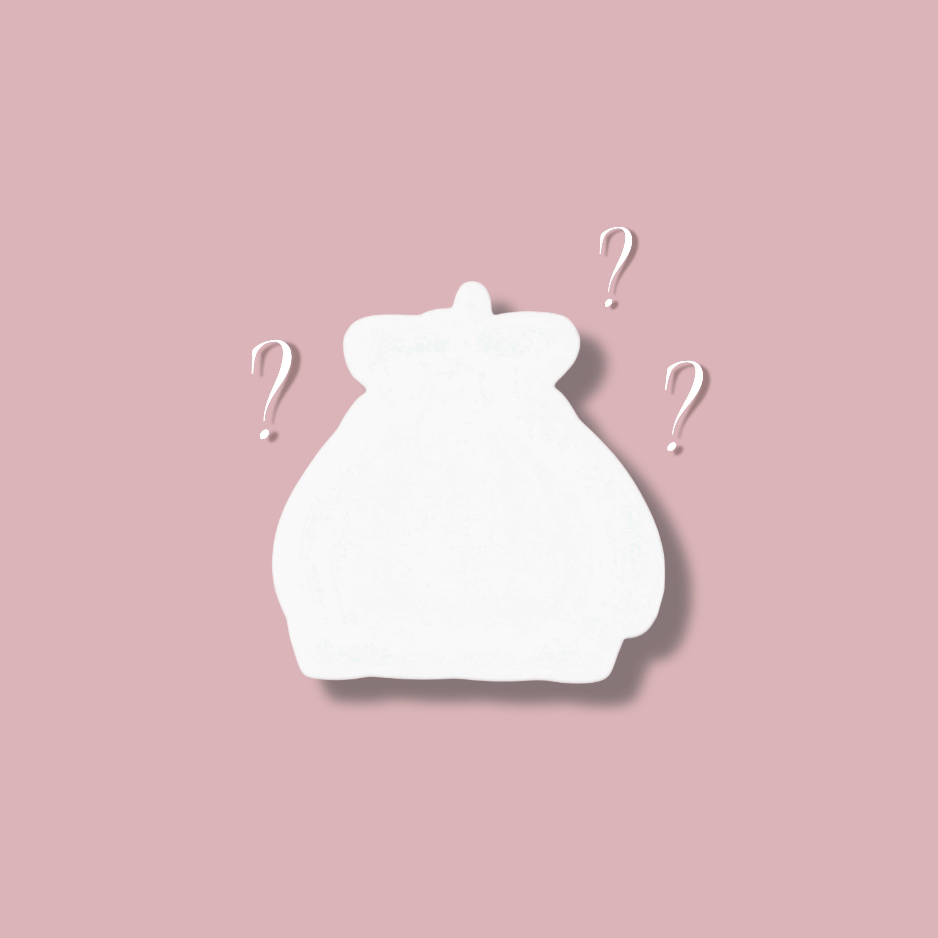 White bunny cutout with question marks on a pink background