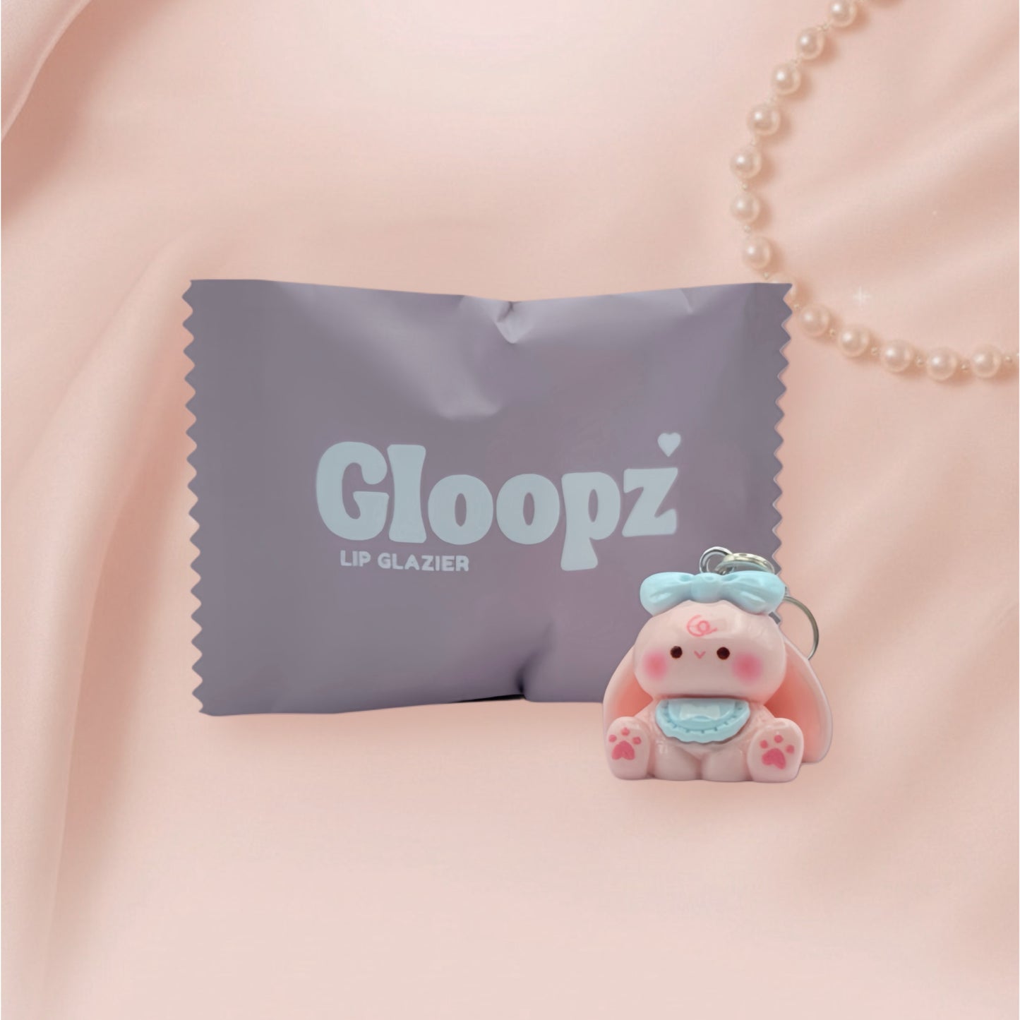 Gloopz lip glazier packaging with a small bunny on a pink background