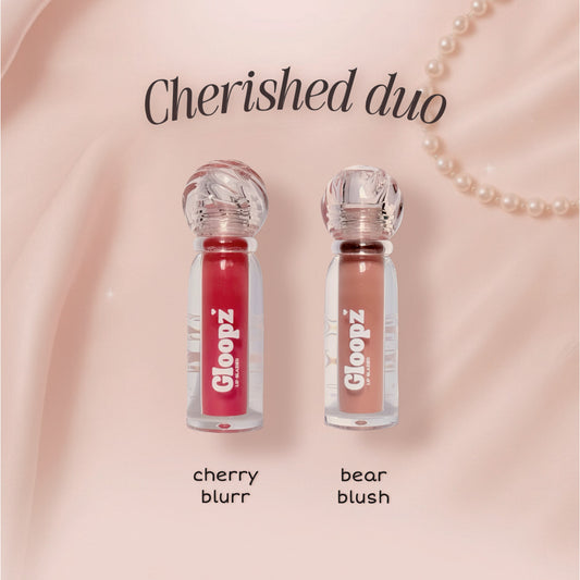 Two lip glosses from Gloopz on a pink background with 'Cherished duo' text.