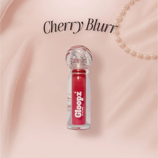 Gloopz Cherry Blurr lip gloss on a pink background with 'Cherry Blurr' text.