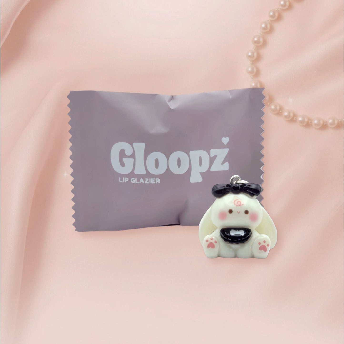 Gloopz lip glazier pack with a cute bunny shaped product on a pink background