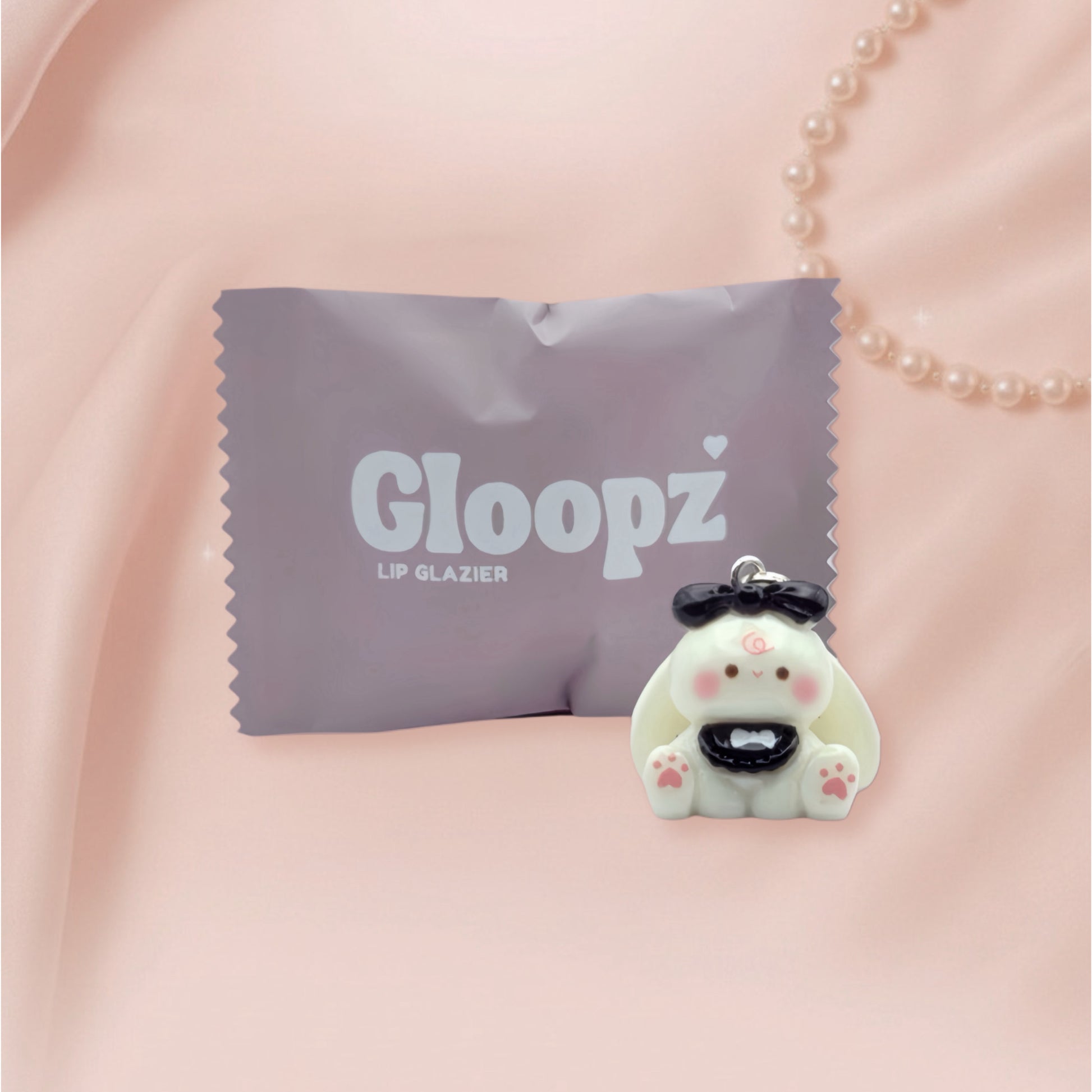 Gloopz lip glazier pack with a cute bunny shaped product on a pink background