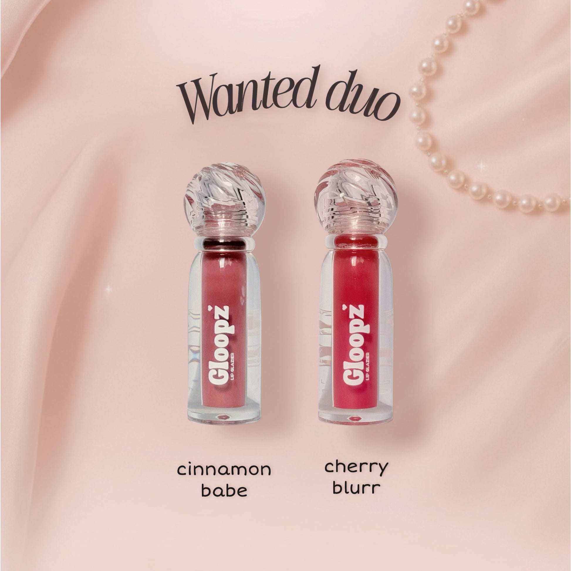 Two lip glosses labeled 'cinnamon babe' and 'cherry blurr' on a pink background with 'Gloopz' branding.